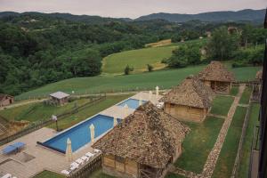 an aerial view of a house with a swimming pool at Etno selo Azbuka in TrÅ¡iÄ‡