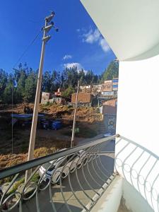a balcony with a view of a city at Shekina Huaraz Departament in Huaraz
