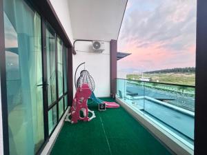a view from the balcony of a building with a pool at Zhara Homestay in Ipoh