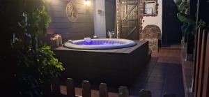 a jacuzzi tub with purple lighting in a yard at Angels Pathway con Jacuzzi in Fátaga +52 photos