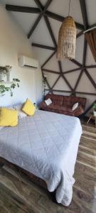 a bedroom with a large bed in a room at Domos munaQ Dusty in San Javier