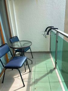 a table and two chairs in a room at The Fresh Wave hotel in Batumi