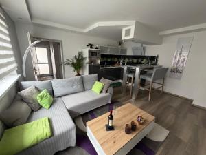 a living room with a couch and a table at Apartment Ferienwohnung in Sulzbach