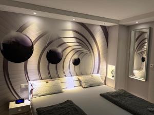 a bedroom with a bed with a curved wall at Apartment Ferienwohnung in Sulzbach