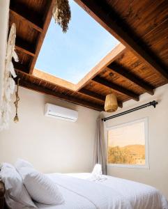 a bedroom with a large window and a bed at Isis Dahab in Dahab