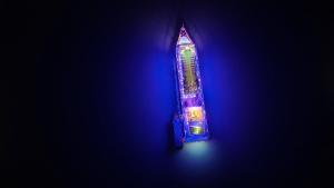 a lit up candy bar with a blue light at Aqua Elegance Cruise - Halong Bay by AHG in Ha Long +149 photos