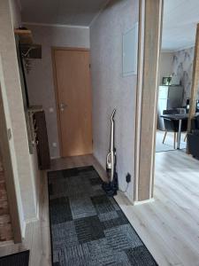 a room with a hallway with a door and a rug at Korter kesklinna piirkonnas in Tartu