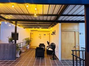 a building with a patio with awning and a door at CASA HOTEL SANTA INES in Mompós +11 photos