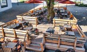 an overhead view of a restaurant with tables and chairs at Königslinde am Tegernsee in Bad Wiessee