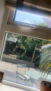 a window in a room with a table and a bench at Southeast Getaway in Limerick