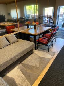 a room with a table and chairs and a dining room at The Workmans Palace in Jelgava