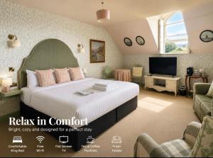 a bedroom with a large bed and a tv at Lynwood house in Cobh