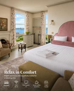 a bedroom with a bed with a view of the ocean at Lynwood house in Cobh