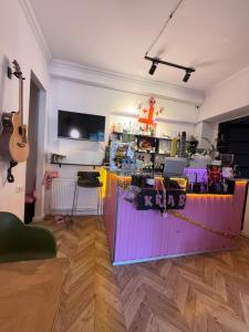 a room with a bar with a guitar in it at Opera City Center Hotel in Tbilisi City