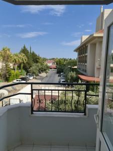 a balcony with a view of a street at ÖZNUR APART OTEL in Side