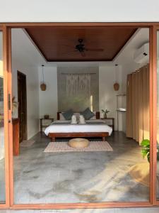 a bedroom with a bed in a room at The Hide El Nido Villas in El Nido +26 photos