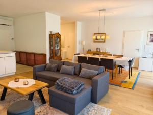 a living room with a couch and a table at Ferienwohnung EPIKUR in Payerbach
