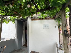 a white garage door with a sign on it at Ferienwohnung Alte Metzgerei in Mesenich