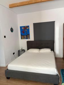 a bedroom with a large bed with white sheets at Little paradise in Limassol