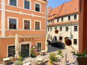 a view of a street in a city with buildings at Malerweg Residenz in Pirna