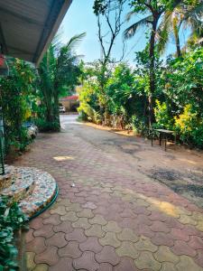 a walk way with a rug on the ground at Baga Sea Link in Baga