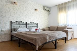 a bedroom with a bed with a teddy bear on it at Porto Franco Sulina in Sulina