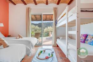 a bedroom with two bunk beds and a staircase at Casa de la Luz | Private 4BR Villa & Pool Escape in Arenas +60 photos