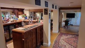 a kitchen with a counter top in a room at The Fox at Ibstone in High Wycombe