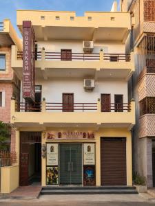 a building with a sign in front of it at Rudraksh Residency in Varanasi