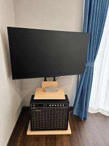 a computer monitor sitting on top of a cpu at Nikko Holiday Home Sumica in Nikko