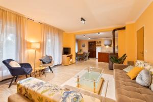 a living room with a couch and a table at Vikendica Donji Humac in Donji Humac