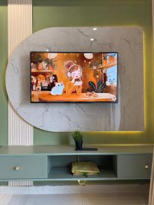 a mirror on top of a shelf in a room at Designer One Bedroom Apartment With Balcony & Mountain Views Opposite Centaurus Mall ISB in Islamabad