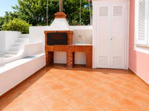 an outdoor patio with a fireplace on a house at Maridea - Vela in Ponza +10 photos
