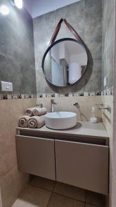 a bathroom with a sink and a mirror at Los Olivos in San Luis