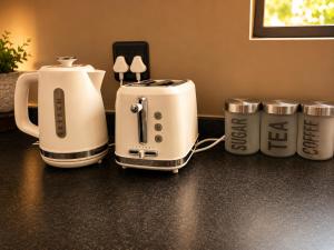 two coffee machines sitting on top of a counter at Lloyds - 6 in Ermelo