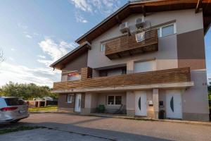 a building with a balcony on the side of it at Poli in Šmarje-Sap