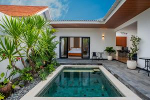 a pool in the backyard of a villa at Villa Dake Tanah Lot in Tanah Lot +16 photos