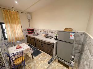 a kitchen that is being remodeled with a refrigerator at Maison-Lala Takerkoust et agafay in Lalla Takerkoust