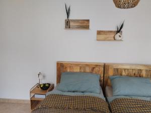 two beds sitting next to each other in a bedroom at Apartmán pod hradom B in Trenčín