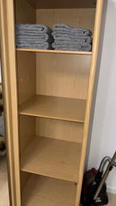 a wooden shelf with blue towels in a room at Радуга in Chon-Sary-Oy +22 photos