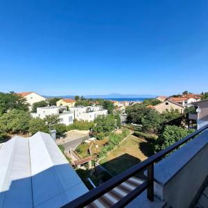 a view from the balcony of a house at Room Mate in Malinska