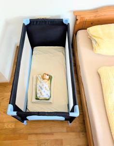 a bed in a room with two beds at Ferienwohnung Weiding in Rutzenmoos
