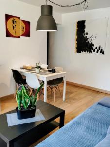 a living room with a desk and a table at Studio park Katowice/Chorzów in Chorzów