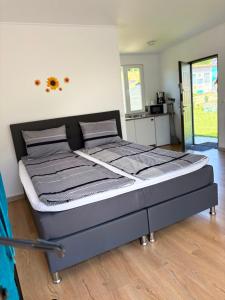 a large bed in a room with at Lacurile IRION in Hoghilag