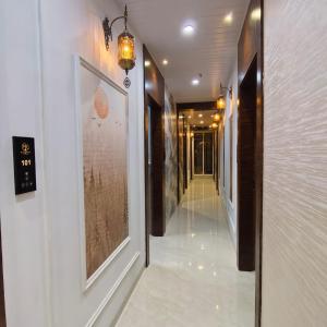 a hallway with paintings on the walls of a building at Mi Residency Lodging & Boarding in Thane +108 photos