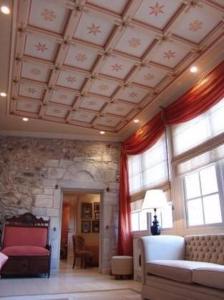 a living room with a coffered ceiling and a couch at Pyrgos Of Mystra in Mystras