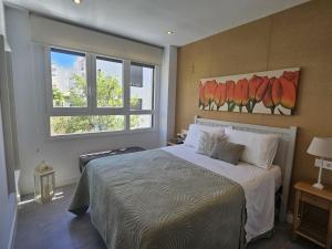 a bedroom with a bed and a window at Marina Serena in La Cala de Mijas +19 photos