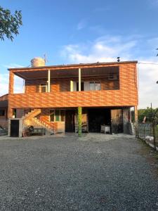 a brick house with a staircase in front of it at Villa de Ureki in Ureki