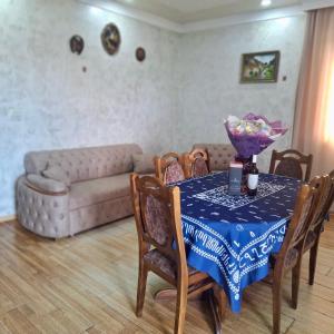 a living room with a table and chairs with a couch at Villa de Ureki in Ureki