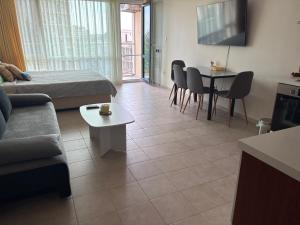 a living room with a couch and a table at Miramar Palace 612S in Sunny Beach